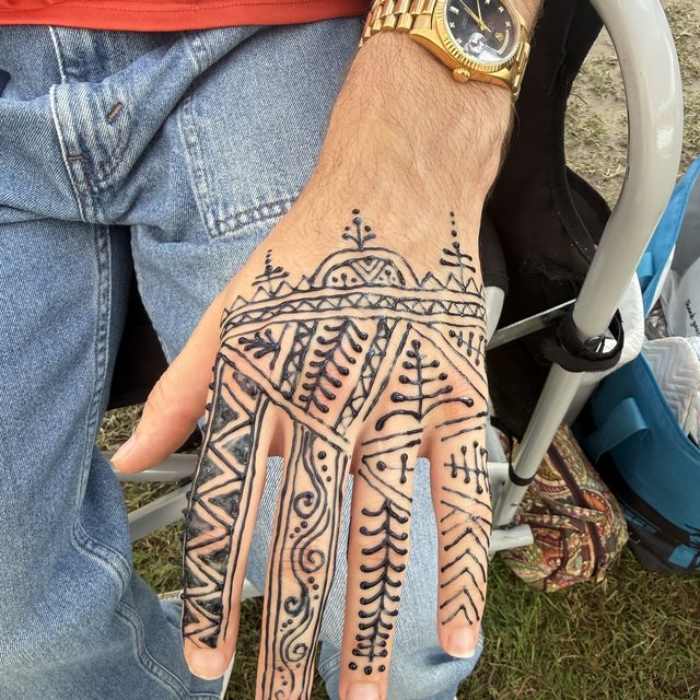 Geometric henna pattern on the hand