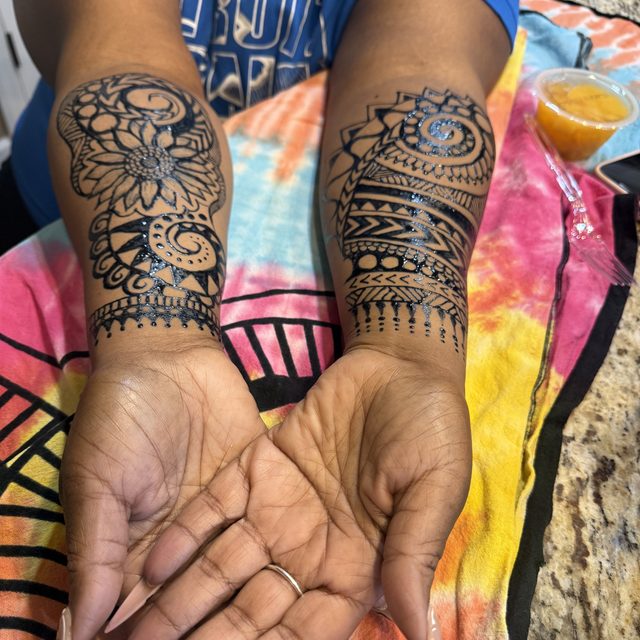 Geometric mandala henna design on the palm