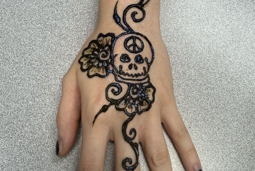 Skull and rose henna design by Henna House